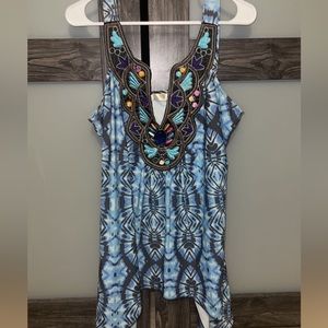 Blue flow-y summer tank top with jeweled trim at neck line.